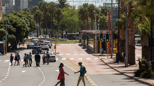 Pedestrians cross Adderley Street in Cape Town, South Africa, on Tuesday, Feb. 8, 2022. South African President Cyril Ramaphosa will deliver a state-of-the-nation address on Thursday, Feb. 10. Photographer: Dwayne Senior/Bloomberg
