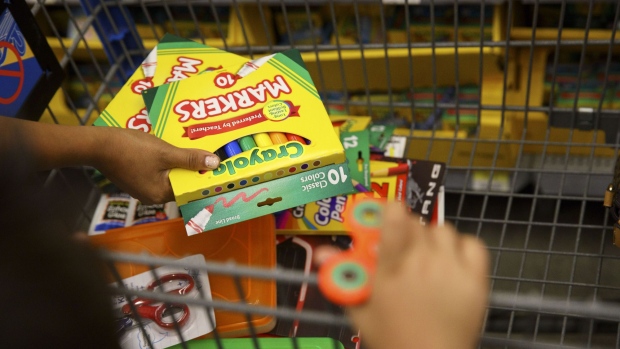 A customer places Crayola LLC markers into a shopping cart at a Wal-Mart Stores Inc. location in Burbank, California, U.S., on Tuesday, Aug. 8, 2017. Wal-Mart Stores is scheduled to release earnings figures on August 17. Photographer: Patrick T. Fallon/Bloomberg