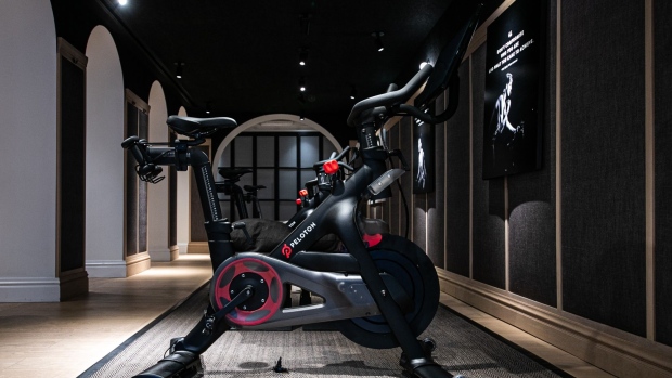Peloton Interactive Inc. stationary bicycles sit on display at the company's showroom on Madison Avenue in New York, U.S., on Wednesday, Dec. 18, 2019. The stakes are high for Peloton as it heads into its first holiday season as a publicly traded company. Peloton projected sales of $410 million to $420 million for the quarter ending Dec. 31, up about 60% from the same quarter a year earlier.
