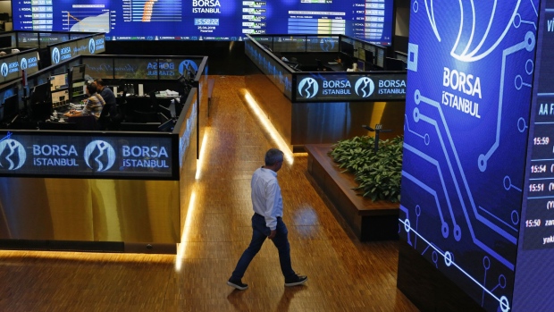 A trader walks across the trading floor at the Borsa Istanbul stock exchange in Istanbul, Turkey, on Monday, June 25, 2018. The gains in Turkey’s lira that followed Recep Tayyip Erdogan’selection victory fizzled out as investors worried that the president’s sweeping new powers may stymie efforts to rein in inflation and the widening current-account deficit. Photographer: Kostas Tsironis/Bloomberg
