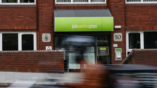 A motorcyclist passes a job centre plus employment office in London, U.K., on Friday, July 24, 2020. Almost half of businesses taking part in the U.K. government's coronavirus jobs program expect to let go of furloughed staff when support ends in October.
