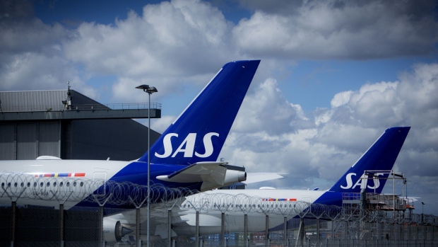 Passenger aircraft, operated by SAS AB, on the tarmac at Copenhagen Airport in Copenhagen, Denmark, on Tuesday, July 5, 2022. Scandinavian airline SAS AB filed for Chapter 11 to tackle its debt burden as the recovery from the disruption caused by the coronavirus pandemic has been slower than expected.