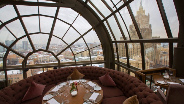 The view from the White Rabbit restaurant shows the city skyline and one of the Seven Sisters skyscrapers in Moscow, Russia, on Tuesday, Dec. 4, 2018. A handful of Russian chefs are starting to gain international attention, and Moscow is now home to a couple of destination restaurants. Photographer: Andrey Rudakov/Bloomberg