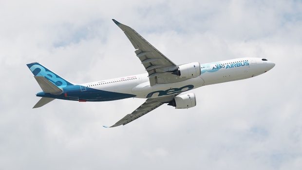 An Airbus SE A330neo passenger aircraft flies above the 53rd International Paris Air Show at Le Bourget in Paris, France, on Monday, June 17, 2019. The show is the world's largest aviation and space industry exhibition and runs from June 17-23.