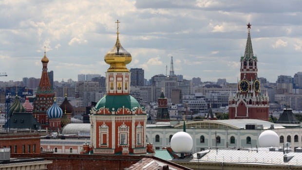 St Basil's cathedral, left, and the Spasskaya tower, right, stand on the city skyline in Moscow, Russia, on Saturday, June 9, 2018. FIFA expects more than three billion viewers for the World Cup that begins this week in Russia. Photographer: Andrey Rudakov/Bloomberg
