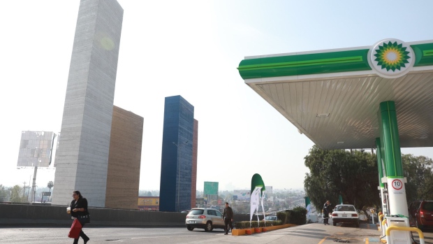 A pedestrian passes in front of Mexico's first BP Plc gas station in Mexico City, Mexico, on Friday, March 10, 2017. BP Plc said it will develop as many as 1,500 Mexican gasoline stations by 2022, deepening its commitment to become a major new player in the country's energy revival. Photographer: Susana Gonzalez/Bloomberg