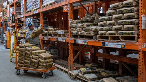 A customer stacks bags of cement inside a Home Depot store in Livermore, California, US, on Thursday, May 12, 2022. Home Depot Inc. is scheduled to release earnings figures on May 17. Photographer: David Paul Morris/Bloomberg