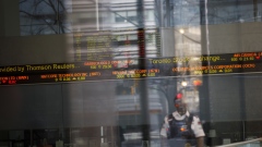 A Toronto Stock Exchange (TSX) ticker is seen in the financial district of Toronto, Ontario, Canada, on Monday, March 16, 2020. Canadian stocks plunged more than 9% after emergency measures from central banks failed to soothe fears the economy will suffer a heavy blow from the coronavirus. Photographer: Cole Burston/Bloomberg
