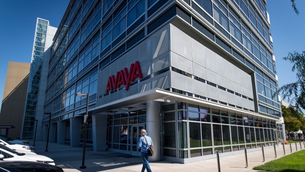 A pedestrian walks in front of Avaya Holdings Corp. headquarters in Santa Clara, California, U.S., on Thursday, Sept. 12, 2019. Avaya is in talks to form a joint venture with videoconferencing provider RingCentral Inc. and is leaning toward abandoning plans for a full sale of the company.