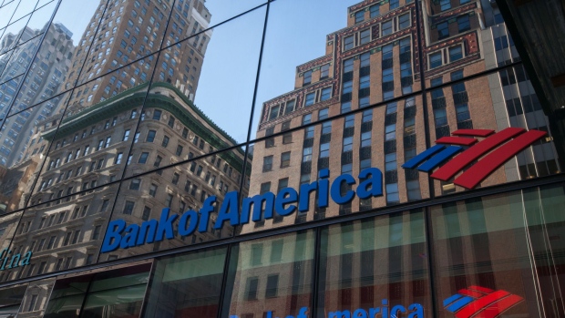 Building are seen reflected on the exterior of a Bank of America Corp. branch in New York, U.S., on Monday, Jan. 15, 2018. Bank of America Corp. is scheduled to release earnings figures on January 17.