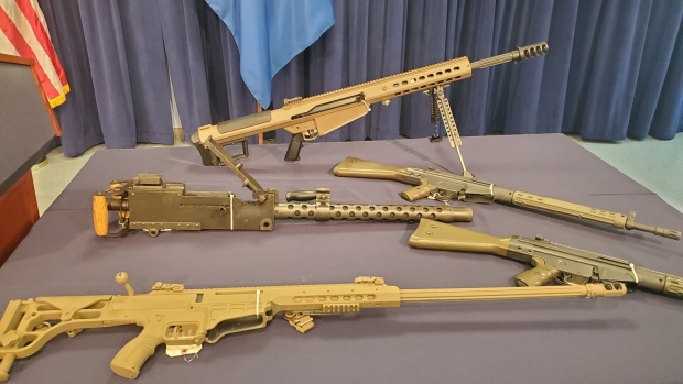 High caliber rifles and machine guns seized by federal agents en route to Haiti. 