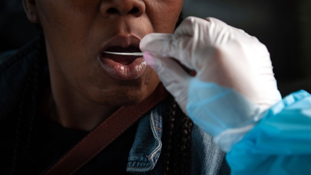 A resident receives a Covid-19 swab test during a mobile clinic at Saint Paul MB Church in Cleveland, Mississippi, U.S., on Saturday, Jan. 8, 2022. The Mississippi State Department of Health reported 6,774 new cases and 16 new deaths as of Friday. Photographer: Rory Doyle/Bloomberg