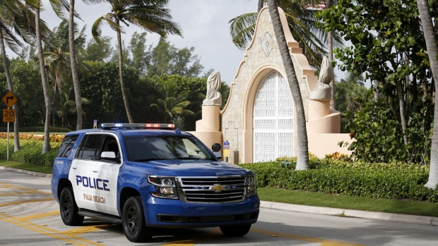 A Palm Beach Police officer at the entrance of former US President Donald Trump's house at Mar-A-Lago in Palm Beach, Florida, US, on Tuesday, Aug. 9, 2022. Donald Trump faces intensifying legal and political pressure after FBI agents searched his Florida home in a probe of whether he took classified documents from the White House when he left office, casting a shadow on his possible run for the presidency in 2024.