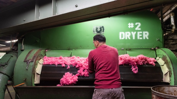 A worker checks dried dyed fiber for unwanted material at the G.J. Littlewood & Sons Inc. raw stock dye house in Philadelphia, Pennsylvania, U.S., on Monday, Jan. 27, 2020. The U.S. Census Bureau is scheduled to release factor orders figures on February 4.