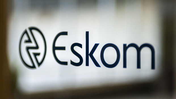 A company logo is displayed during a news conference to announce the Eskom Holdings SOC Ltd. full year results at their headquarters in Johannesburg, South Africa, on Tuesday, July 30, 2019. Eskom reported a record loss of 20.7 billion rand. Photographer: Waldo Swiegers/Bloomberg