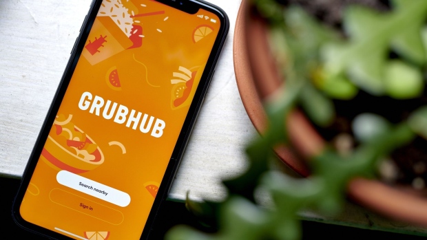 The Grubhub logo on a smartphone in the Brooklyn borough of New York, US, on Friday, July 8, 2022. Grubhub struck a deal with Amazon for the e-commerce giant to offer Prime users in the US a one-year membership to its food delivery service. Photographer: Gabby Jones/Bloomberg