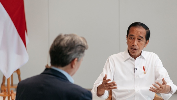 Joko Widodo, Indonesia's president, right, speaks during an interview with John Micklethwait, editor-in-chief of Bloomberg News, at the Hyundai Motor Manufacturing Indonesia in Cikarang, Indonesia, on Thursday, Aug. 18, 2022. Chinese President Xi Jinping and Russian leader Vladimir Putin are both planning to attend a Group of 20 summit in the resort island of Bali later this year, Widodo said.