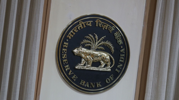 The logo of the Reserve Bank of India (RBI) at their headquarters in Mumbai, India, on Friday, April 8, 2022. India’s central bank signaled a shift in policy focus as it ramped up efforts to mop up excess liquidity in the banking system and raised its inflation forecasts, sending bond yields higher. Photographer: Dhiraj Singh/Bloomberg