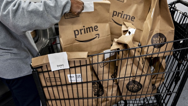 Amazon Prime grocery bags ready for delivery outside a Whole Foods Market store in Washington, D.C., in March 2020.