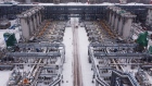 Absorber columns either side of a snow-covered access road at the Gazprom PJSC Slavyanskaya compressor station, the starting point of the Nord Stream 2 gas pipeline, in Ust-Luga, Russia, on Thursday, Jan. 28, 2021. Nord Stream 2 is a 1,230-kilometer (764-mile) gas pipeline that will double the capacity of the existing undersea route from Russian fields to Europe -- the original Nord Stream -- which opened in 2011.