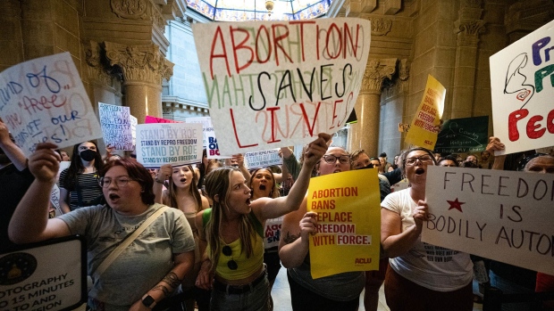 Abortion rights demonstrators shout into the Senate chamber in the Indiana State Capitol building on July 25, 2022 in Indianapolis, Indiana.