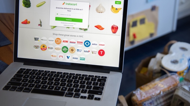 The Instacart website on a laptop computer arranged in Hastings-on-Hudson, New York, U.S., on Monday, Jan. 4, 2021. A booming market for U.S. initial public offerings shows no sign of slowing in 2021. Grocery-delivery company Instacart Inc. is preparing for a listing, according to people familiar with the matter. Photographer: Tiffany Hagler-Geard/Bloomberg