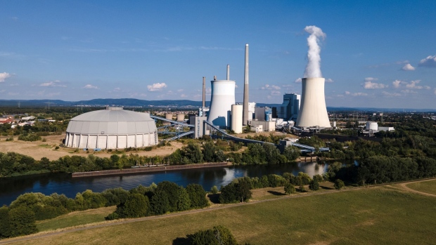 Vapor is released from a cooling tower at the Staudinger coal and gas power plant, operated by Uniper SE, on the banks of the River Main, a tributary of the River Rhine, in Grosskrotsenberg, Germany, on Tuesday, Aug. 16, 2022. Uniper reported a loss of more than 12 billion euros ($12.2 billion), ranking among the biggest in German corporate history and laying bare the unprecedented crisis engulfing Europe's energy markets.