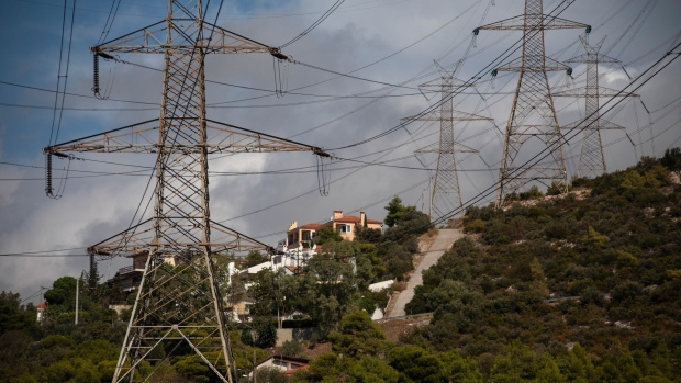 Electricity transmission pylons near residential homes in Gerakas suburb, northeast of Athens, Greece, on Tuesday, Oct. 12, 2021. European Union leaders are poised to authorize next week emergency measures by member states to blunt the impact of the unprecedented energy crisis on the most vulnerable consumers and companies.