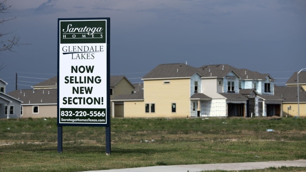 A "Now Selling" sign outside the Glendale Lakes community home development in Arcola, Texas, US, on Tuesday, July 12, 2022. In an American housing market that for years has been plagued by too little inventory, builders are suddenly finding themselves with a glut of unsold homes.