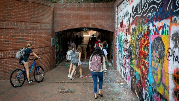 Students walk through the "Free Expression Tunnel" on campus at North Carolina State University in Raleigh, North Carolina, U.S., on Monday, Sept. 13, 2021. The Bloomberg Businessweek 2021-22 Best B-Schools MBA ranking created a Diversity Index for U.S. business schools that for the first time measures race, ethnicity, and gender.