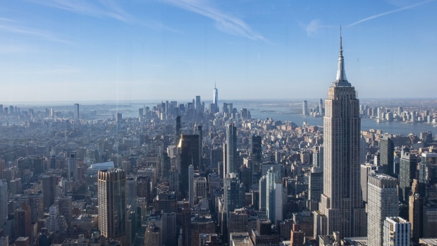The New York City skyline seen from the Summit One Vanderbilt observation deck during the grand opening in New York, U.S., on Thursday, Oct. 21, 2021. The attraction takes visitors to the 93rd floor, high above iconic skyscrapers like the Empire State Building and the Chrysler Building, and features an immersive art installation called "Air," created by artist Kenzo Digital.