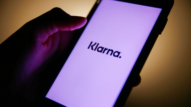 A Klarna logo on a mobile phone arranged in London, U.K., on Thursday, Jan. 21, 2021. Klarna AB, a Swedish payment provider for online shoppers, is still setting its sights on an initial public offering even after its latest funding round left it roughly twice as valuable as it was a year ago. Photographer: Hollie Adams/Bloomberg