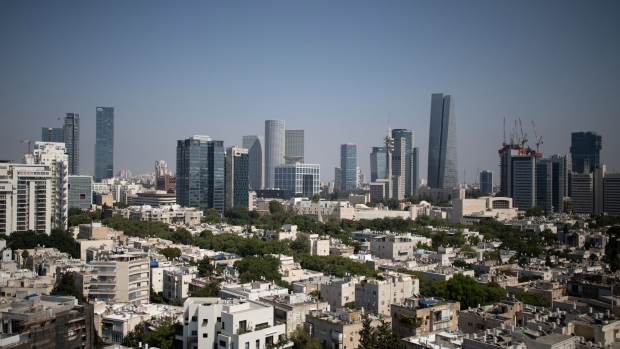 Skyscraper office buildings, including the Azrieli Sarona tower, right, stand beyond residential apartment buildings on the skyline in Tel Aviv, Israel, on Wednesday, July 22, 2020. Israel’s parliament gave the government sweeping authorities to combat a resurgent coronavirus outbreak, weakening its own oversight over cabinet decisions as Prime Minister Benjamin Netanyahu warns of a possible second lockdown. Photographer: Corinna Kern/Bloomberg