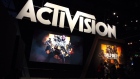 Attendees stand next to signage for Activision Blizzard Inc. Call Of Duty: Black Ops 4 video game during the E3 Electronic Entertainment Expo in Los Angeles, California, U.S. Photographer:  Troy Harvey/Bloomberg