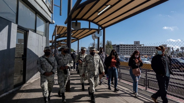 Members of the Mexican National Guard patrol the San Ysidro Port of Entry border crossing bridge in Tijuana, Mexico, on Sunday, March 20, 2022. In FY22 so far, the number of Ukrainians and Russians encountered at the border has already surpassed the previous two years, with the most significant uptick happening in the last six months, as Russia’s threats against Ukraine increased, according to a TIME analysis of CBP data.