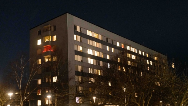 Electric lights on a block of residential flats in the Hisingen district, in Gothenburg, Sweden, on Monday, Jan. 17, 2022. The Swedish government set aside 6 billion kronor ($664 million) to lessen the impact of soaring power bills on households, saying Russia’s approach to supplying gas to Europe this winter was a major factor in stoking costs last month.