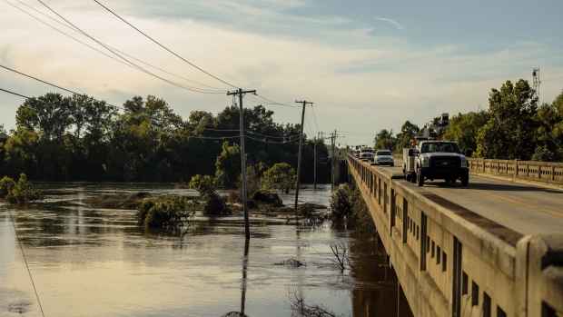 Vehicles travel on a bridge across the Pearl River during a water shortage in Jackson, Mississippi, US, on Thursday, Sept. 1, 2022. The governor of Mississippi called in the National Guard to help residents of the state capital after a plant failure left at least 180,000 people in the area without access to safe water.