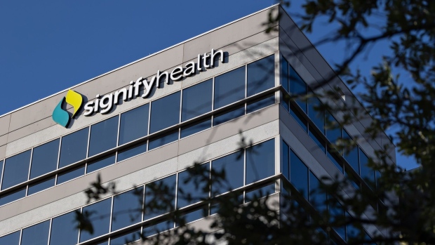 Signage outside Signify Health headquarters in Dallas, Texas, US, on Monday, Aug. 8, 2022. Signify Health Inc. rose the most in nine months after a report that CVS Health Corp. is planning to submit a bid to acquire the provider of technology and services for home health. Photographer: Shelby Tauber/Bloomberg
