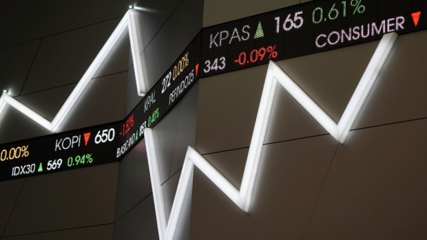 Tickers display stock prices inside the Indonesia Stock Exchange (IDX) in Jakarta, Indonesia, on Thursday, April 18, 2019. With Indonesian President Joko Widodo on course to win a second term as leader, the political uncertainty that's weighed on the economy this year will be lifted. Photographer: Dimas Ardian/Bloomberg