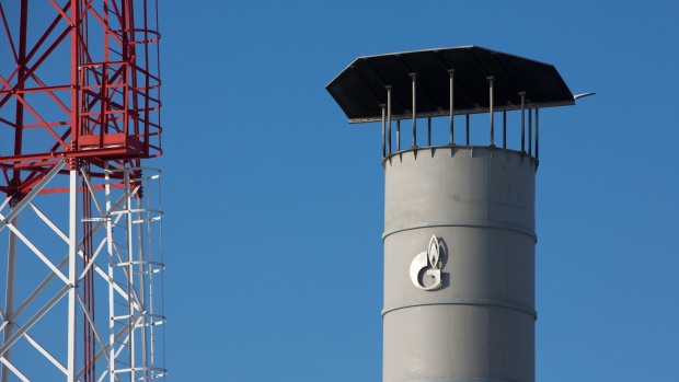 A company logo sits on a chimney tower in the yard at the Gazprom PJSC Atamanskaya compressor station, part of the Power Of Siberia gas pipeline, near Svobodny, in the Amur region, Russia, on Wednesday, Dec. 11, 2019. The pipeline, which runs from Russia’s enormous reserves in eastern Siberia and will eventually be 3,000 kilometers (1,900 miles) long, will help satisfy China’s vast and expanding energy needs. Photographer: Andrey Rudakov/Bloomberg