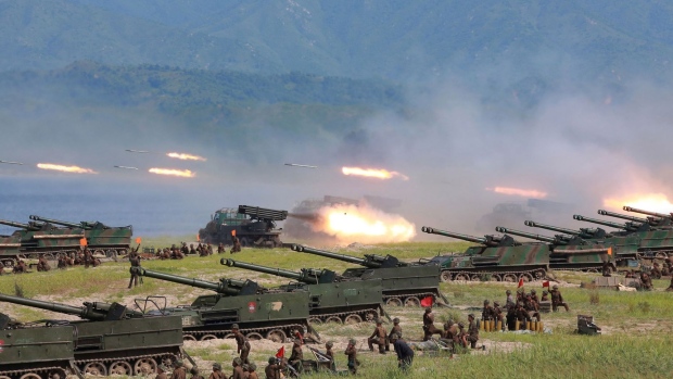 Rockets launched by the Korean People's Army during a strike exercise in North Korea.  Photographer: STR/AFP/Getty Images