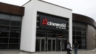 Pedestrians pass a Cineworld Group Plc cinema in Aldershot, U.K., on Monday, Oct. 5, 2020. Cineworld said it will temporarily suspend operations at all its American and British movie theaters now that crucial income from winter blockbusters has been pushed into 2021 by the coronavirus pandemic.