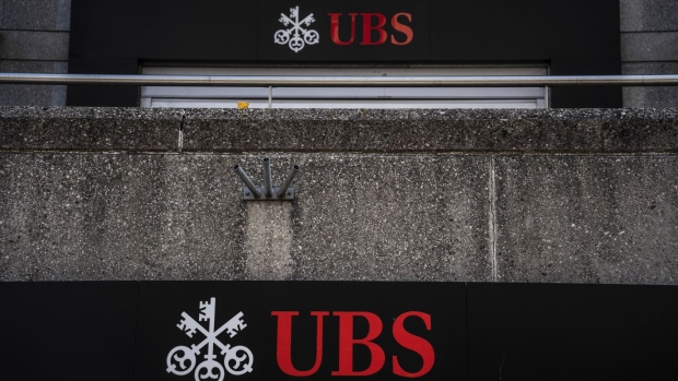 Signage outside a UBS Group AG bank branch in Geneva, Switzerland, on Monday, July 25, 2022. UBS report second-quarter earnings on July 26. Photographer: Jose Cendon/Bloomberg