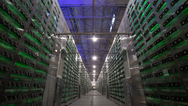 Power and ethernet cables connected to mining rigs at the Minto cryptocurrency mining center in Nadvoitsy, Russia, on Friday, Dec. 17, 2021. Bitcoin extended its five-week slide from an all-time high with risk sentiment across global financial markets dwindling.