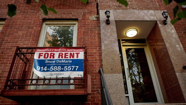 A "For Rent" sign outside an apartment building in the East Village neighborhood of New York. Photographer: Gabby Jones/Bloomberg