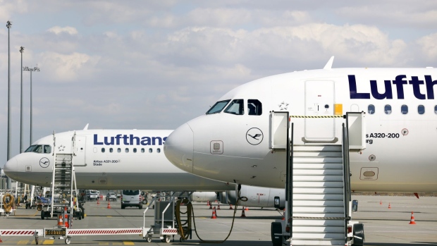 Parked Airbus SE A321, left, and A320 aircraft, operated by Deutsche Lufthansa AG, during a strike by the airline's pilots, at the under construction Terminal 3 of Frankfurt Airport in Frankfurt, Germany, on Friday, Sept. 2, 2022. Lufthansa suspended almost its entire flight operations in Frankfurt and Munich because of a strike by pilots who are demanding higher pay, adding another day of major disruptions to what has already turned into a summer of travel chaos.