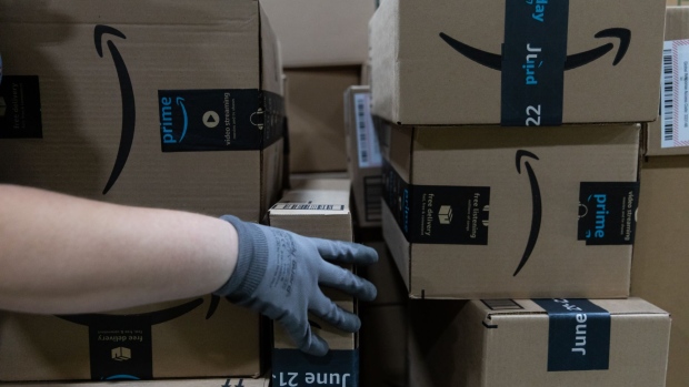 A worker loads boxes onto a pallet at an Amazon fulfillment center on Prime Day in Raleigh, North Carolina, U.S., on Monday, June 21, 2021. Amazon.com Inc.'s annual Prime Day sale, which begins Monday, arrives as the world grapples with the lingering effects of the pandemic.