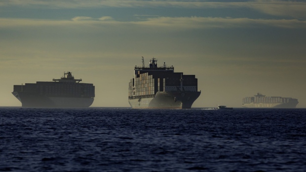 Container ships at anchor outside the Port of Los Angeles in Los Angeles, California, U.S., on Sunday, Nov. 21, 2021. Shipments to the Port of Los Angeles fell 8% year over year in October. Photographer: Tim Rue/Bloomberg