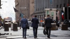 Workers on Wall Street near the New York Stock Exchange. Photographer: Michael Nagle/Bloomberg
