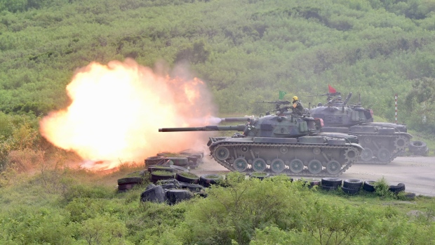 CM-11 tanks fire their cannons during a live-fire military exercise in Pingtung county, southern Taiwan, on September 7, 2022.  Photographer: Sam Yeh/AFP/Getty Images